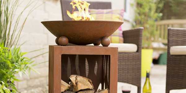La Hacienda Aged Effect Fire Bowl in high quality steel with a practical compartment underneath for fire logs.